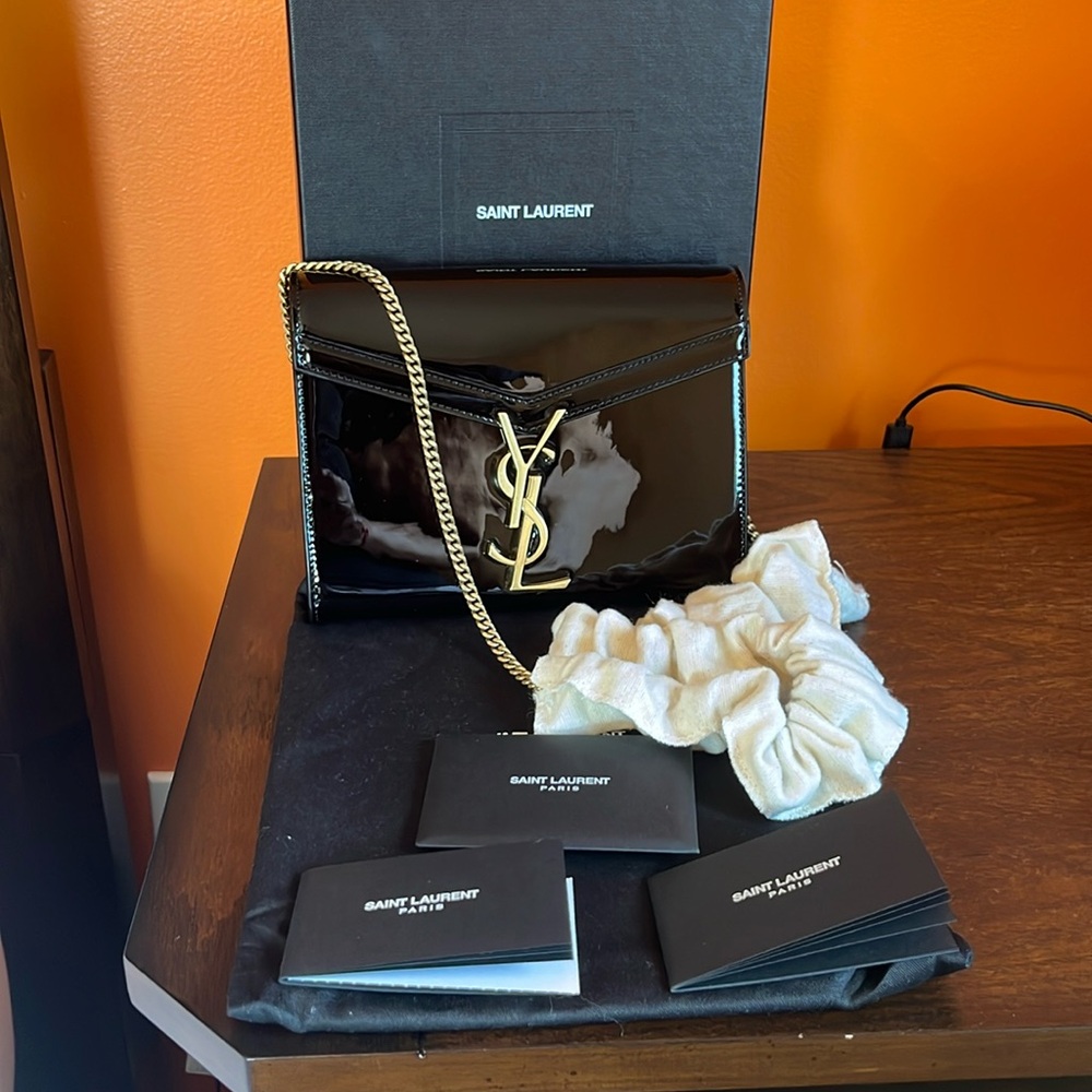New YSL Cassandra Black and Gold hardware Crossbody Bag With Dust bag and Box.